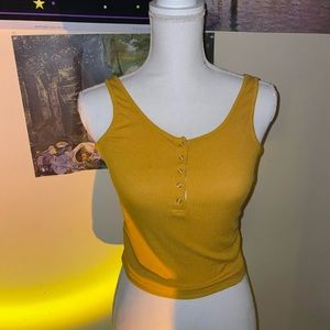 Yellow tank size small would fit a medium .
